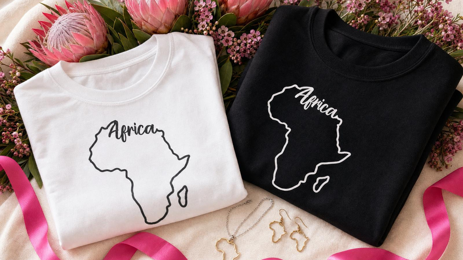 Wild Mongoo Africa print t-shirts, sweatshirt and jewellery styled together with protea flowers for Heritage Month