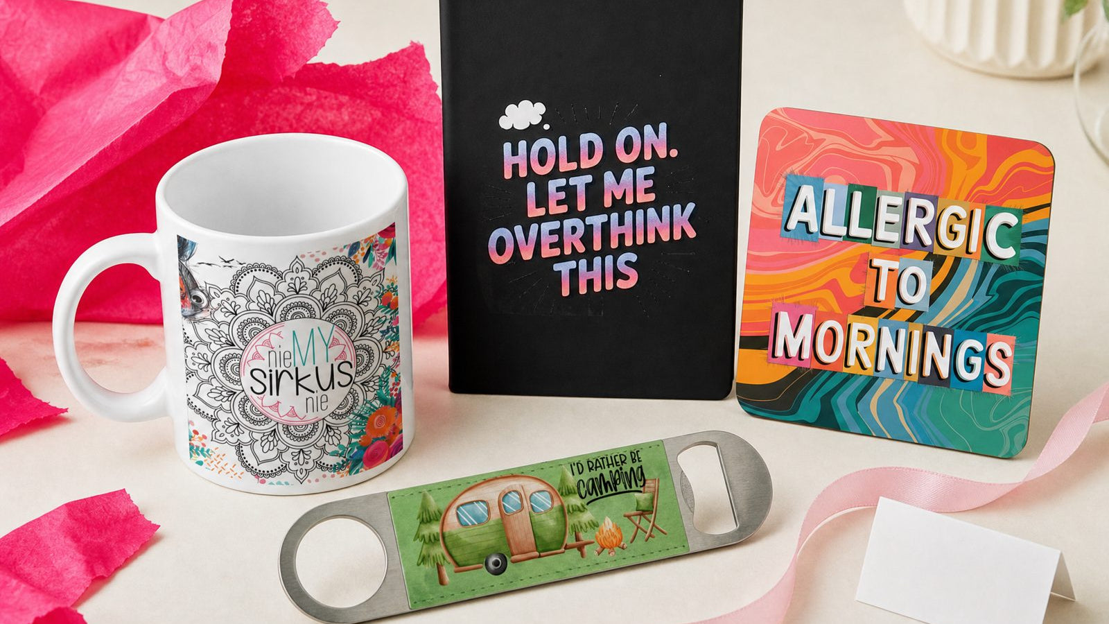 Secret Santa gifts from Wild Mongoo: a Nie My Sirkus mug, an overthinker notebook, a camping bottle opener and a coaster